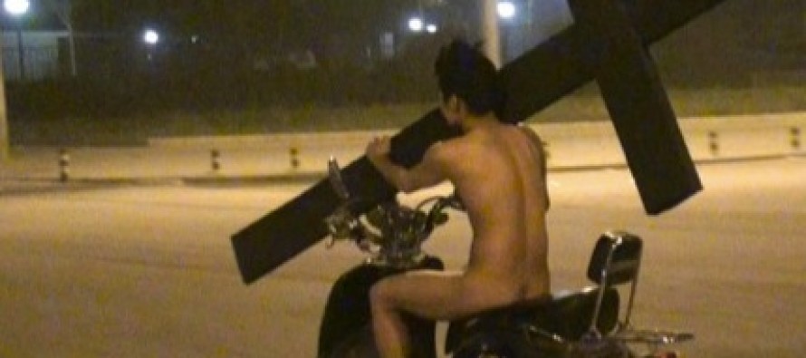 Naked Man Rides Down West State Street On Scooter With Giant Cross